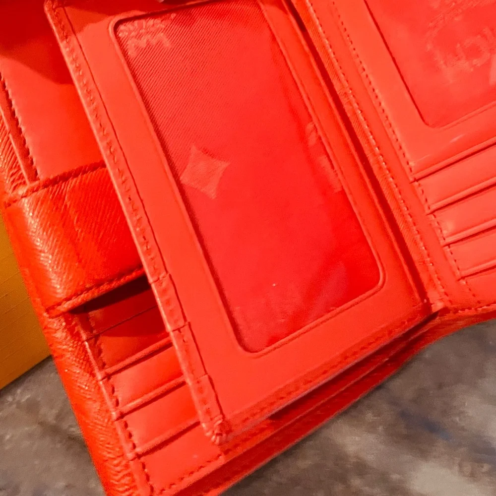 MCM Embossed Leather Compact Wallet